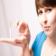 woman flicking off the ciggarette off her hand