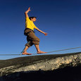 man on a tightrope balancing himself