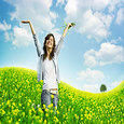 woman enjoying herslef in the field full of flowers