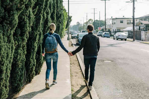 boy and girl on a date holding hands