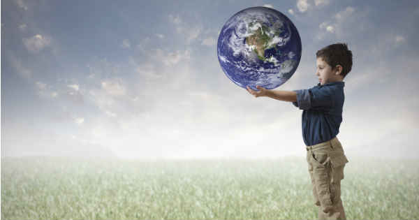 boy holding the world in his hands