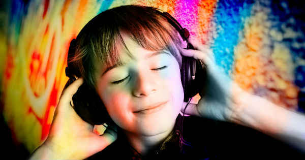 boy listening to hypnosis audio on his headphones