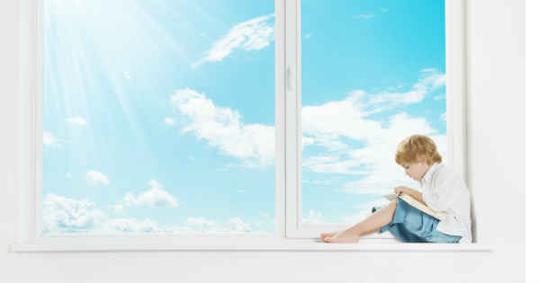 boy sitting on a window