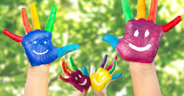 hands with fingerpainted smileys