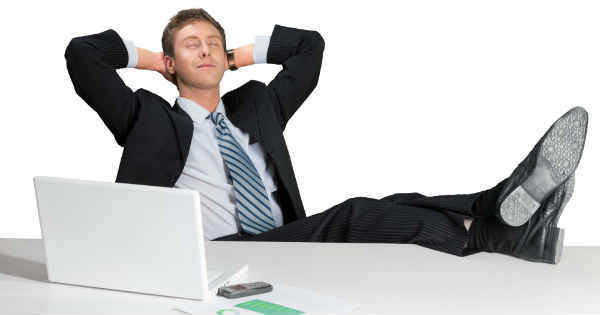 man resting with his feet on table