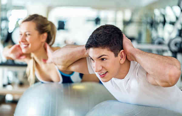 man and woman exercising