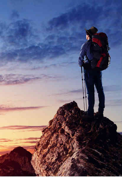 man on mountain top standing