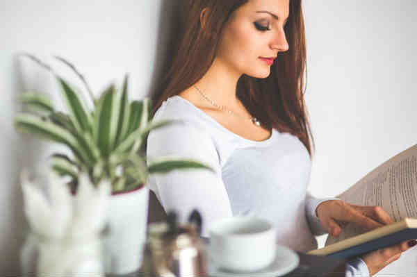 woman reading in a trance-like state