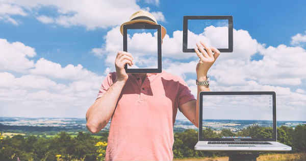 man holding multiple frames