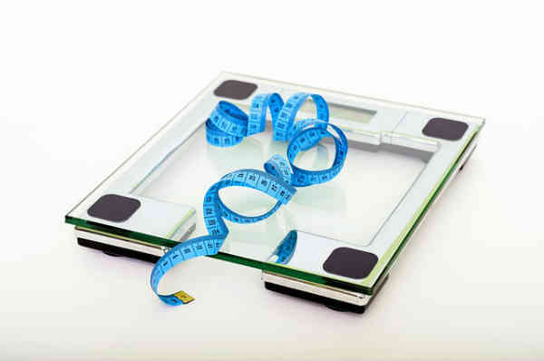 a glass scale and waist meter