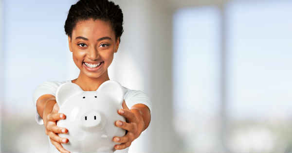 woman holding a piggy bank